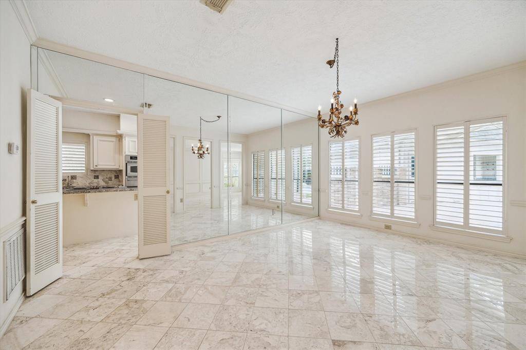 Another view of the formal dining room on the back side of the house. Double doors to close off the kitchen area.