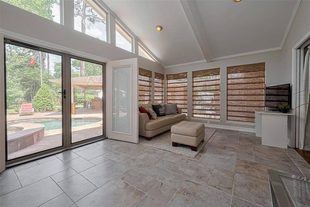 French doors off the sunroom for private access to the hot tub and pool.