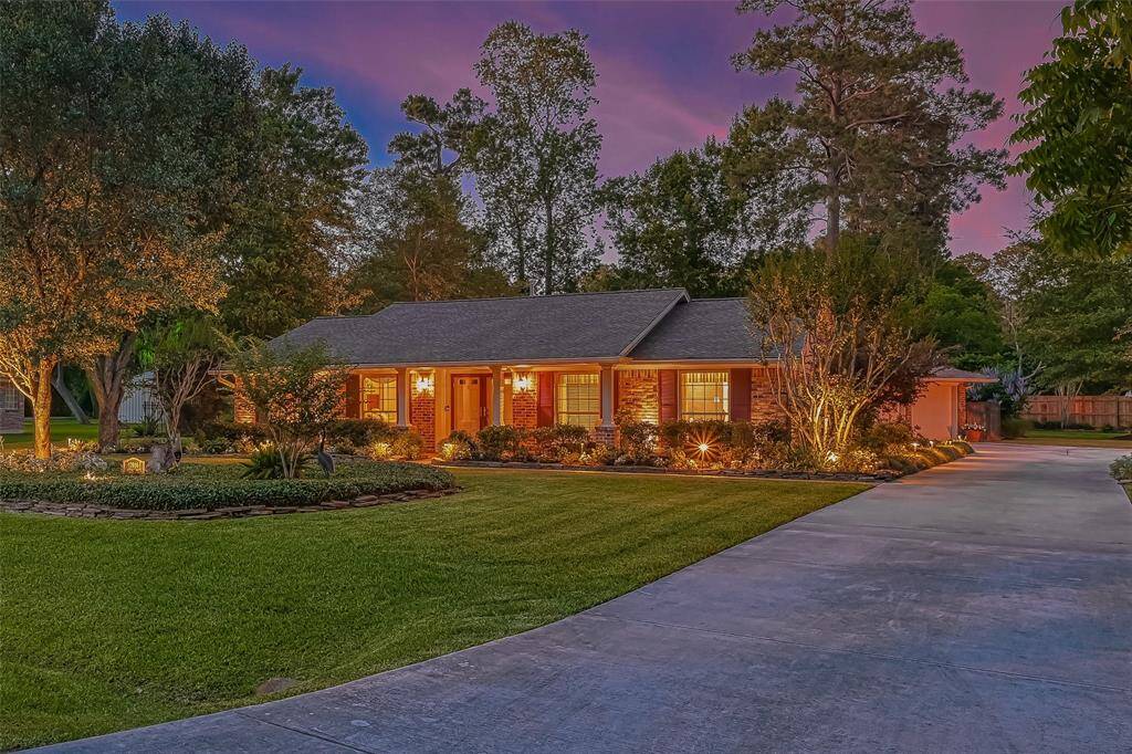Large driveway for plenty of parking and privacy. Two car garage located behind the home.
