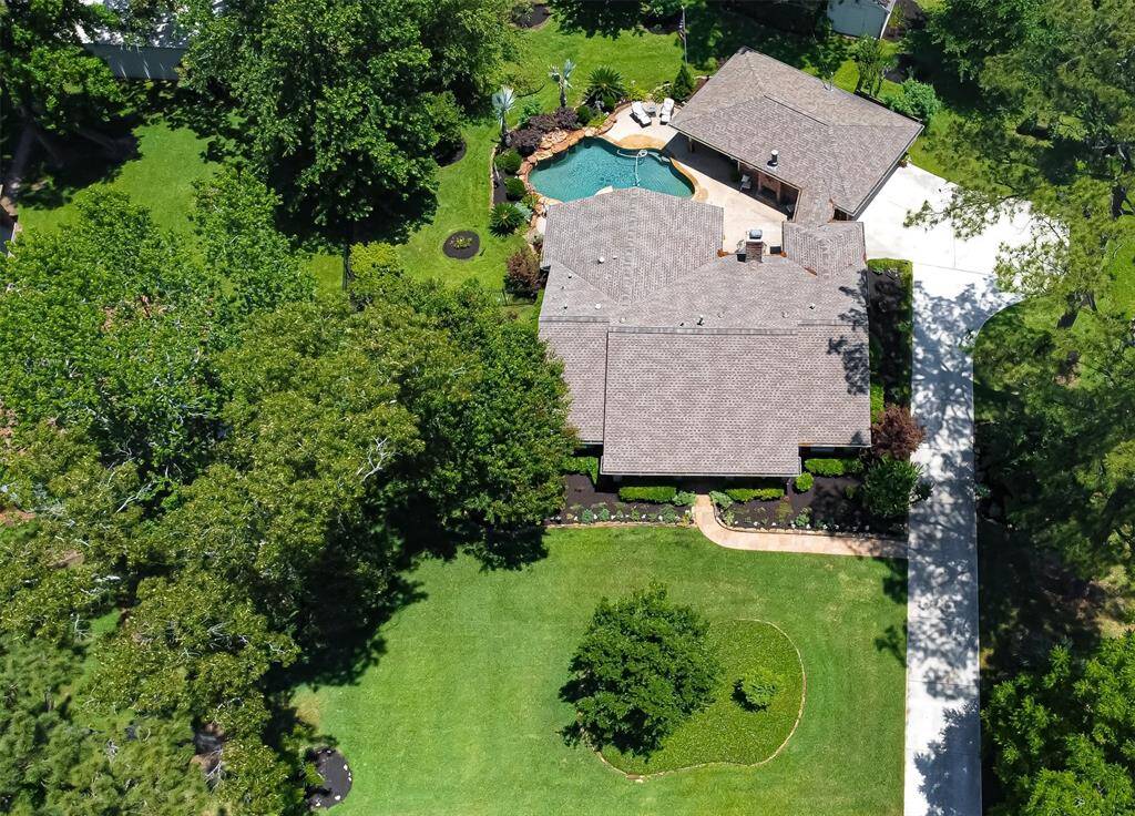 Large half-acre lot offers many use of space options.