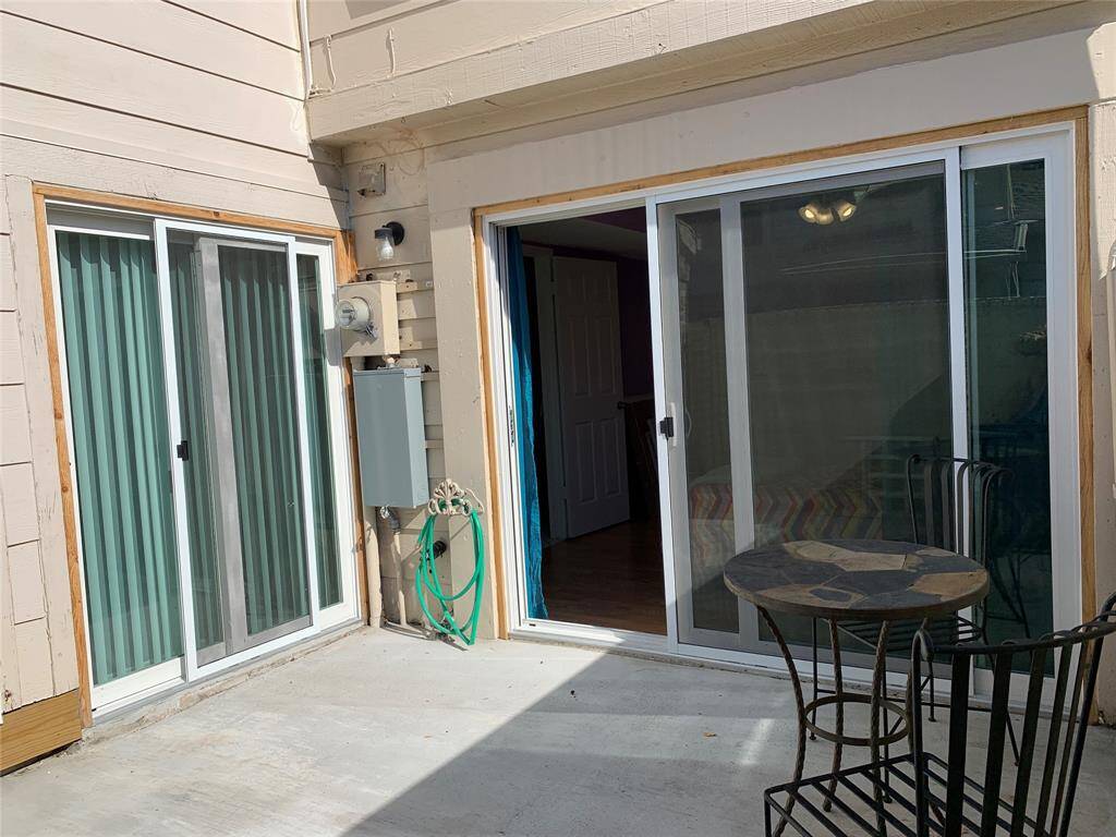 Private patio with access from living room and downstairs bedroom