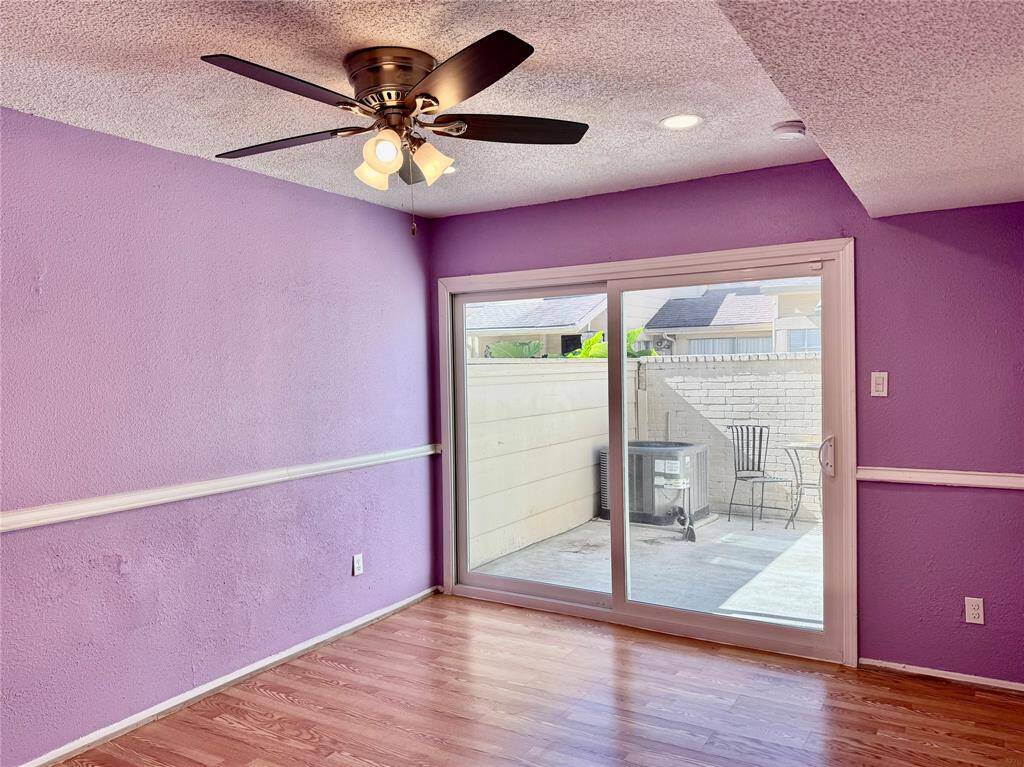 Another view of downstairs bedroom with access to patio