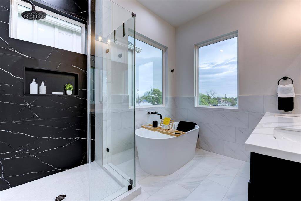 Extraordinary black tile accent in the primary shower