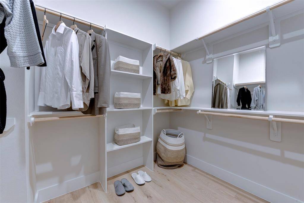 Primary closet has plenty of space for all of your belongings