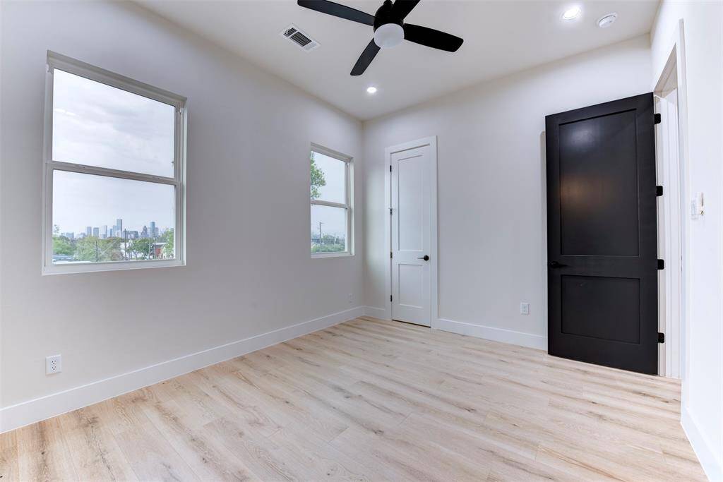 Secondary bedroom with beautiful black door