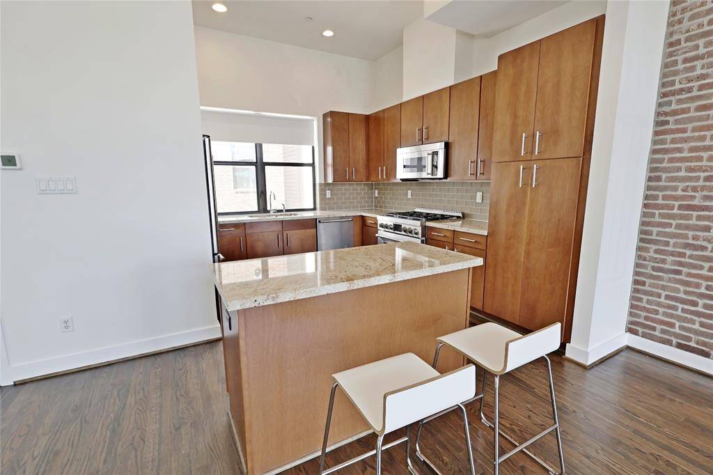 Sleek countertops and modern fixtures, providing both practicality and a touch of luxury