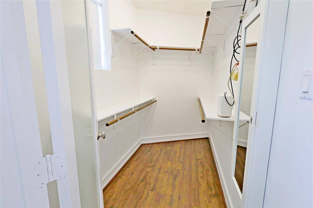 Walk in closet in primary bedroom