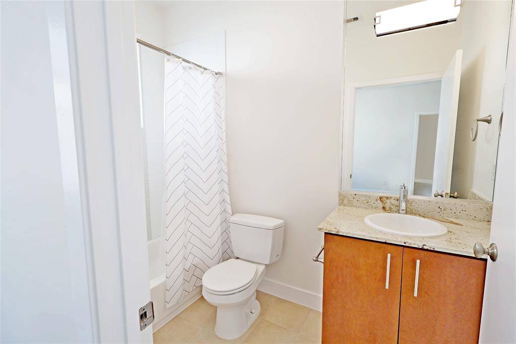 Secondary bathroom next to the primary bedroom.