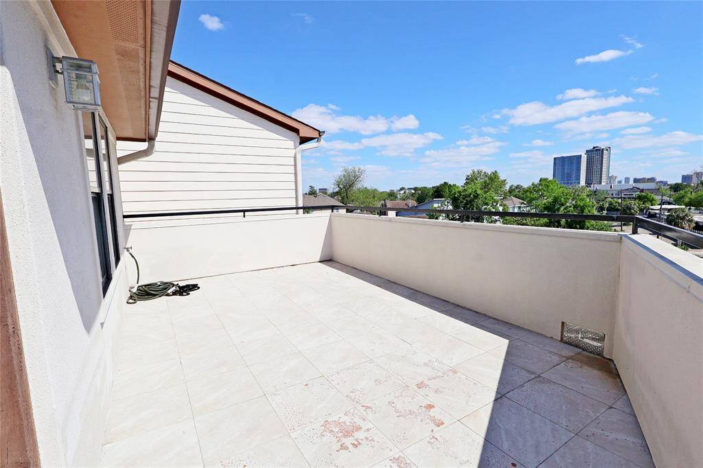 sweeping views of the lively Montrose neighborhood and inviting indoor-outdoor living