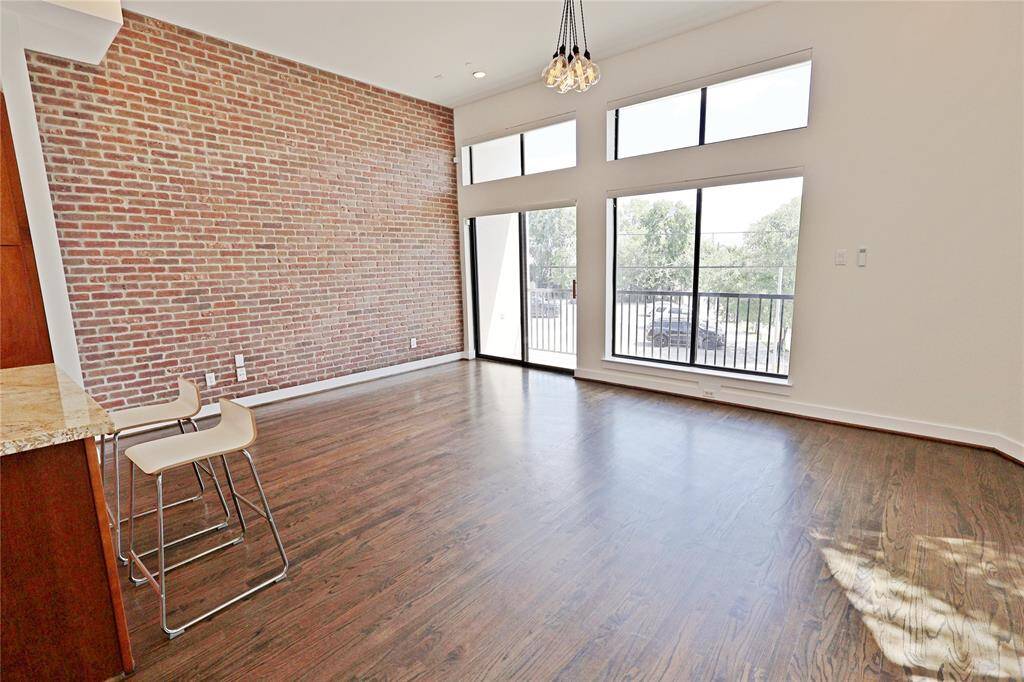 The rich wood floors extend seamlessly throughout the space