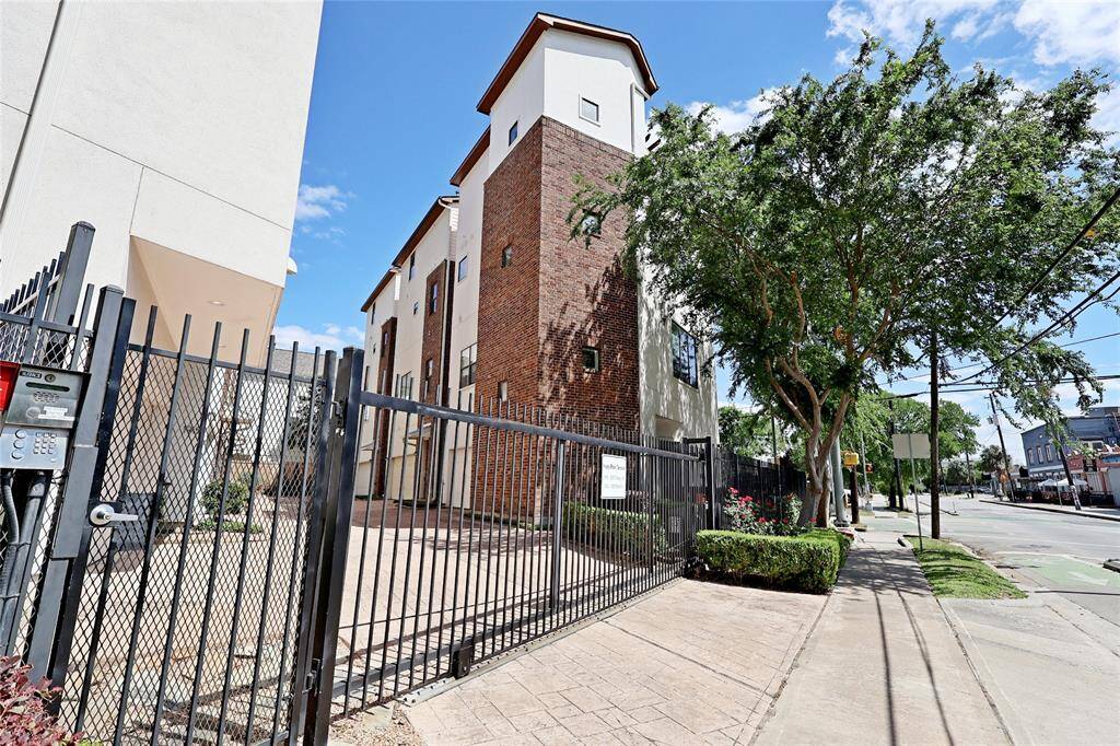 The gated entrance provides both security and an exclusive feel in a walkable community.
