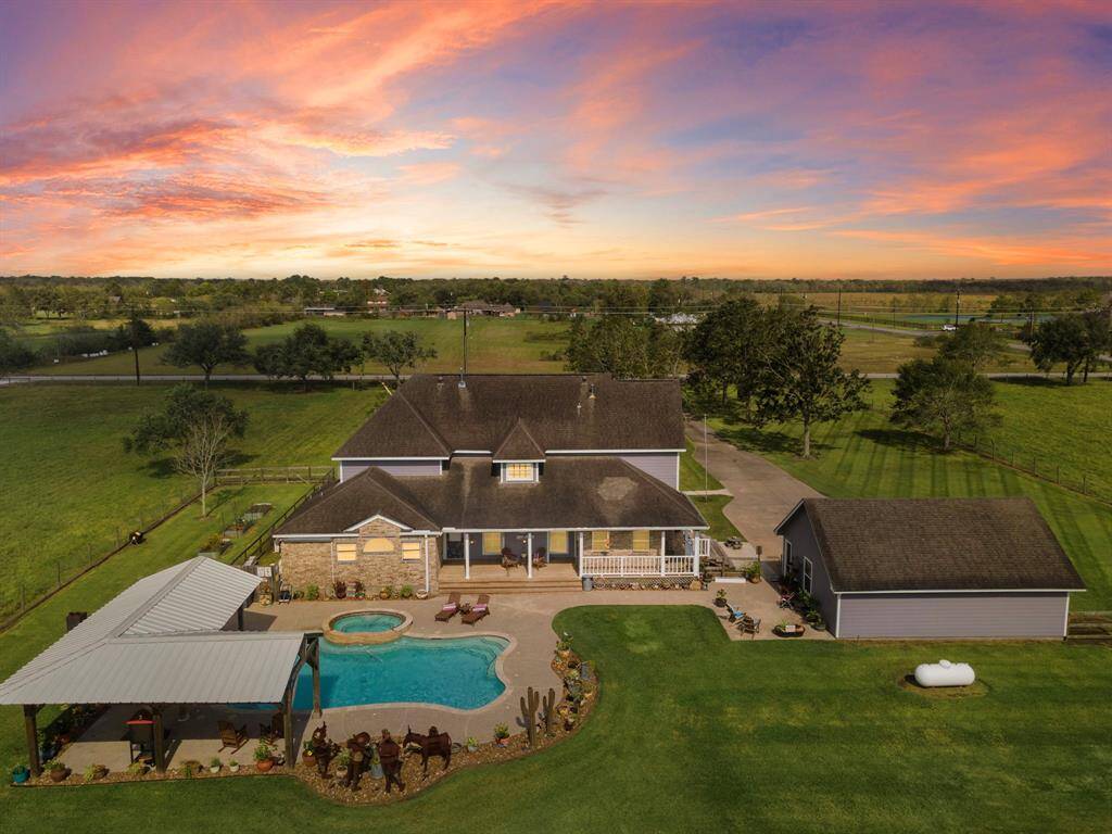 Aerial view of the property from behind the house