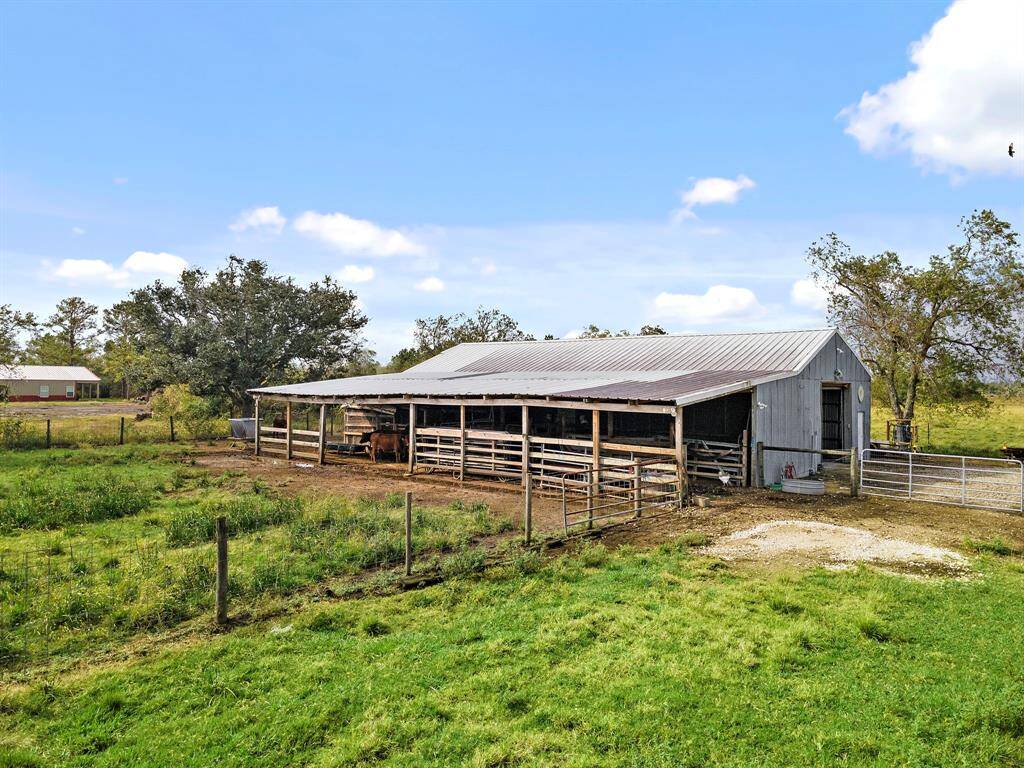 Barn in the back of the property houses 20 chickens and farm equipment