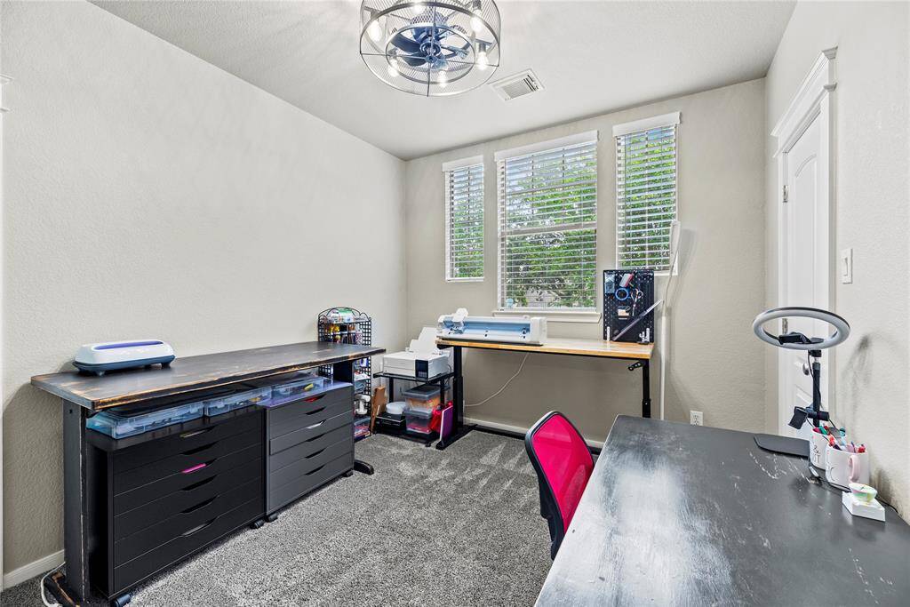 Third of 3 secondary bedrooms found upstairs. Walk-in closets, plush carpet and upgraded fan.