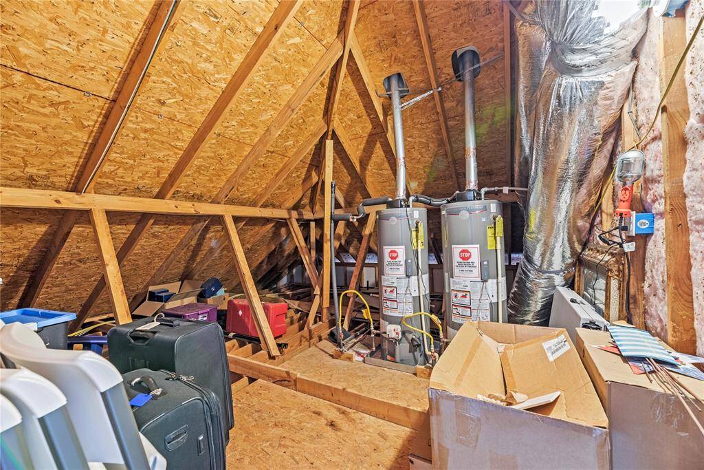 Texas basement walk out attic storage space! It's even larger and more impressive in person!! There are two recently replaced water heaters as well.