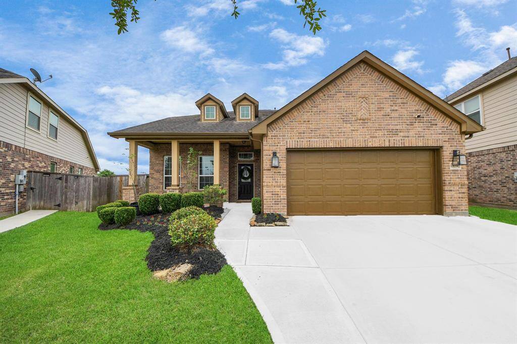 Welcome home! This charming brick-front elevation sets the tone with classic curb appeal, a welcoming front porch, and a timeless design that invites you to relax and stay awhile.
