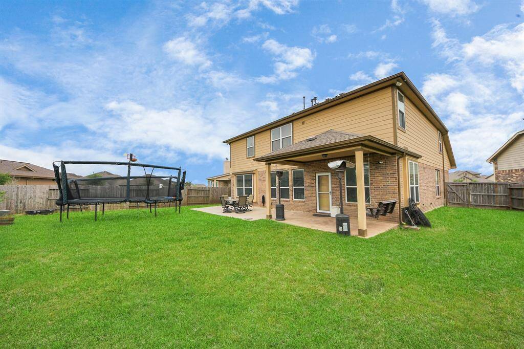 Tucked on a spacious cul-de-sac lot, the backyard is a total standout—plenty of room to play, entertain, or unwind. There’s even a basketball court already in place, with more than enough space left over if you ever want to add a pool.