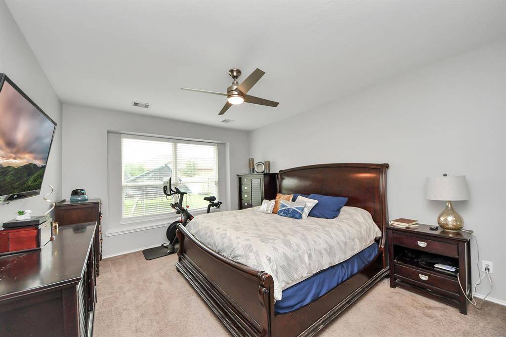 The spacious primary suite offers a peaceful retreat with plenty of room to relax and unwind at the end of the day.