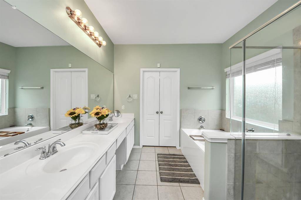 The primary bathroom has everything you need with a soaking tub, separate shower, and dual vanities for added convenience.