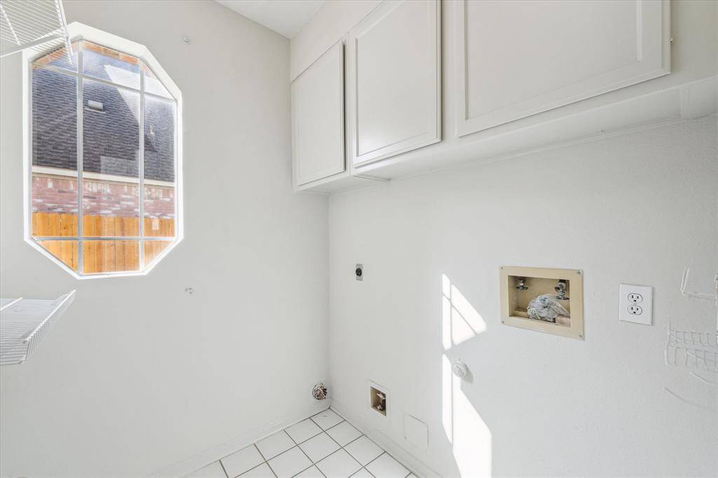 Walk in laundry room is located downstairs.