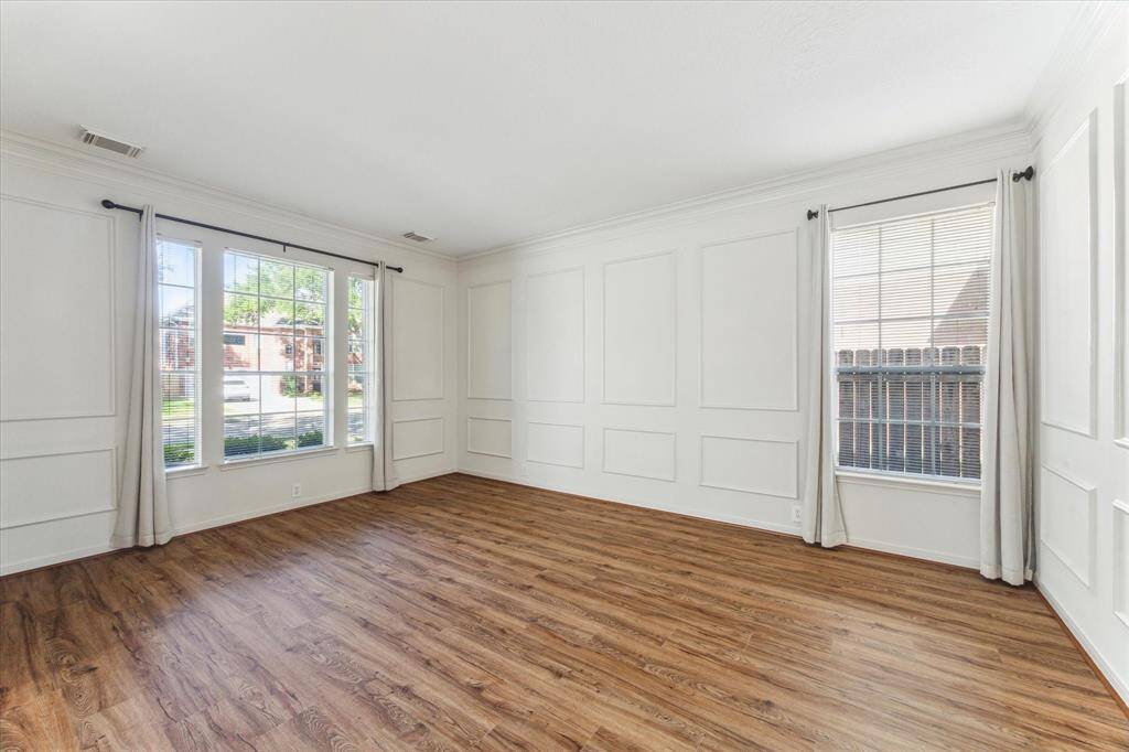 Living room with plenty of light and new vinyl plank flooring.