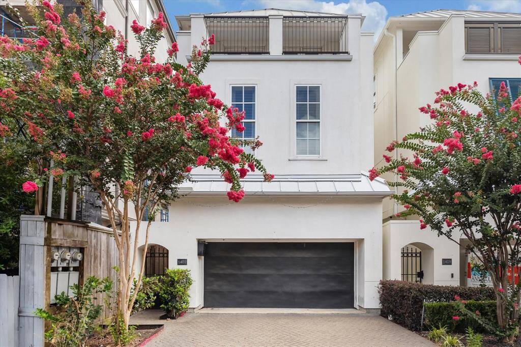 Welcome to 1407 Knox Street, a rare first floor living townhome tucked away in the Woodcrest section of Rice Military.