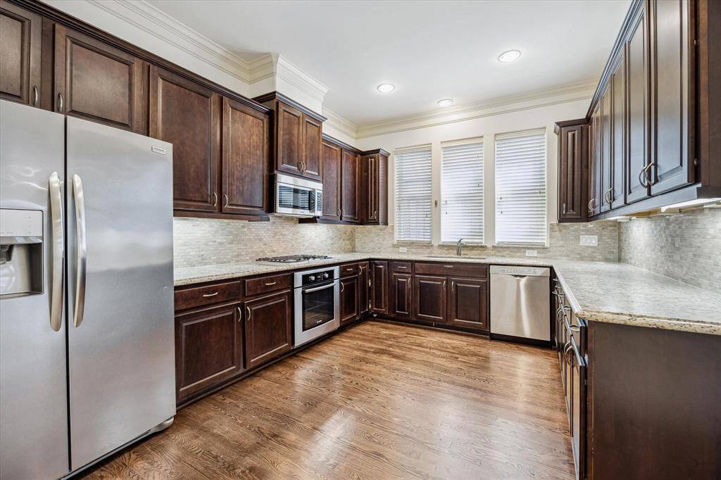 KITCHEN.     With ample storage and Bosch stainless steel appliances.   Nice seperation from the main living area so you don't have to keep it pristine.  The dishes can wait!