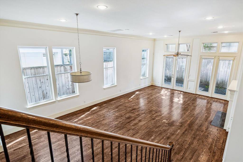 Note all the windows, high ceilings and real hardwood floors.