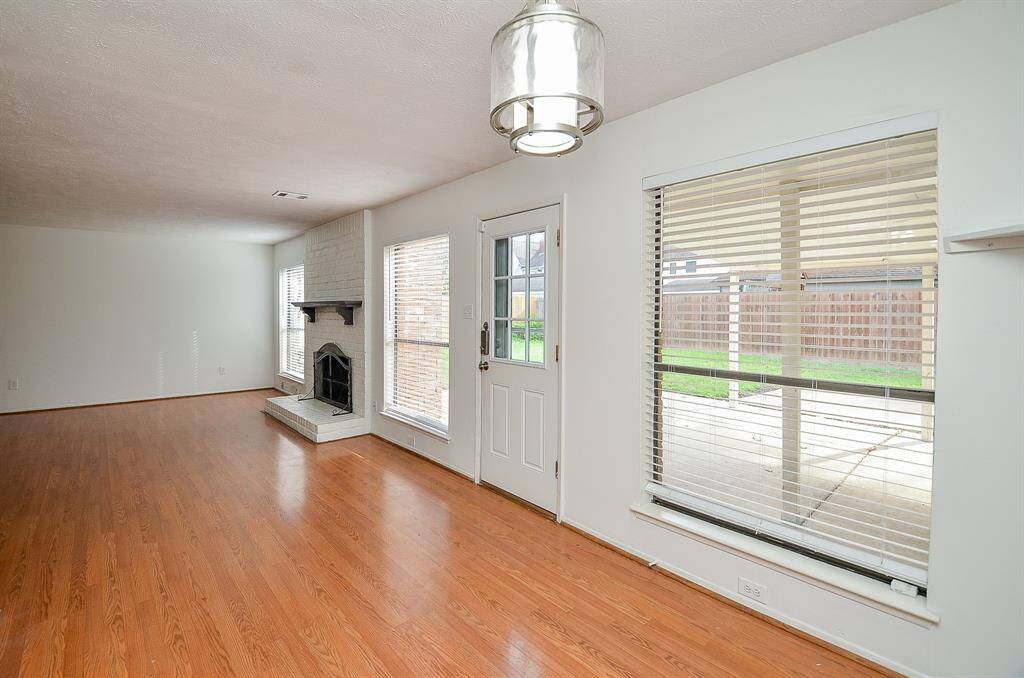 Spacious kitchen featuring sleek laminate countertops and a convenient double oven.