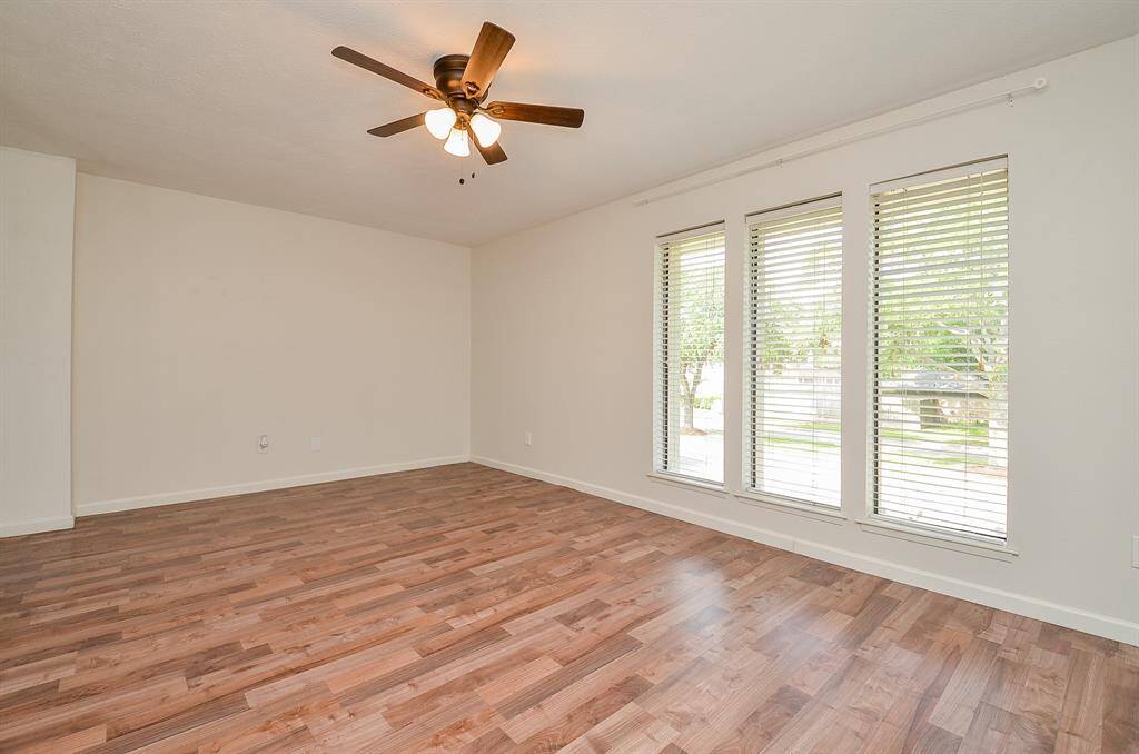 Inviting living room with a cozy fireplace and adjacent breakfast nook.