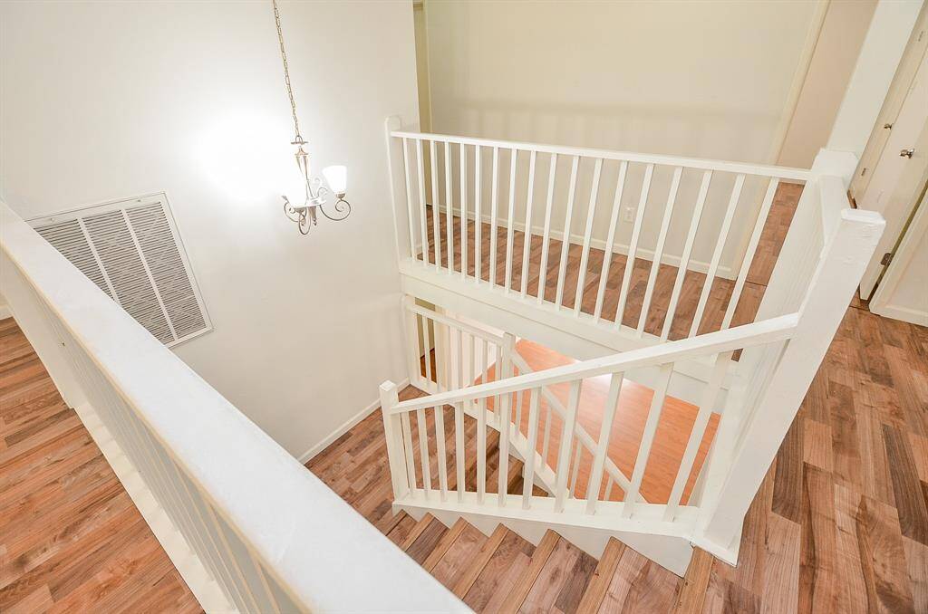 Spacious primary bathroom featuring a dual-sink vanity, elegant fixtures, and ample storage.