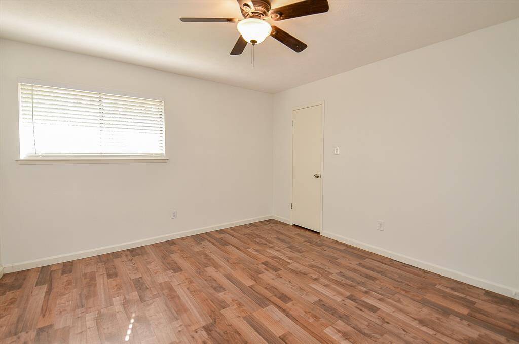 Spacious bedroom with generous closet storage.