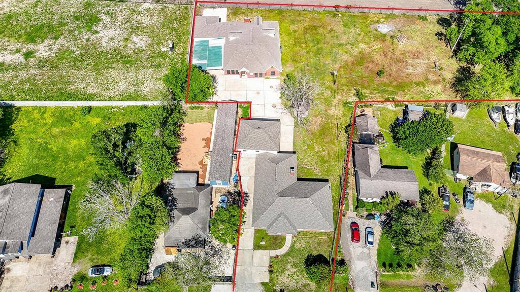 Two houses and a garage apartment on 1.29 acre lot