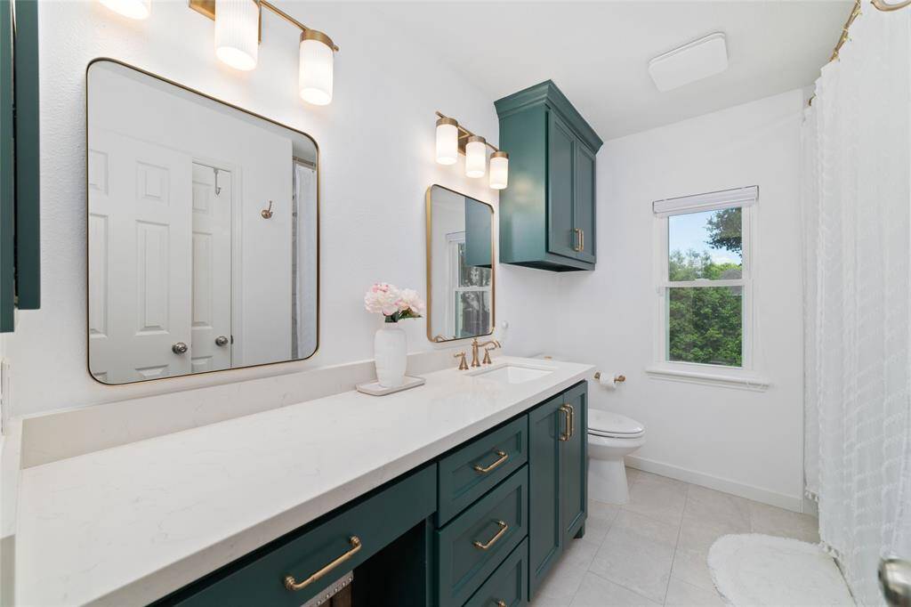 Secondary bathroom totally remodeled with quartz counters and lots of drawers and cabinets.