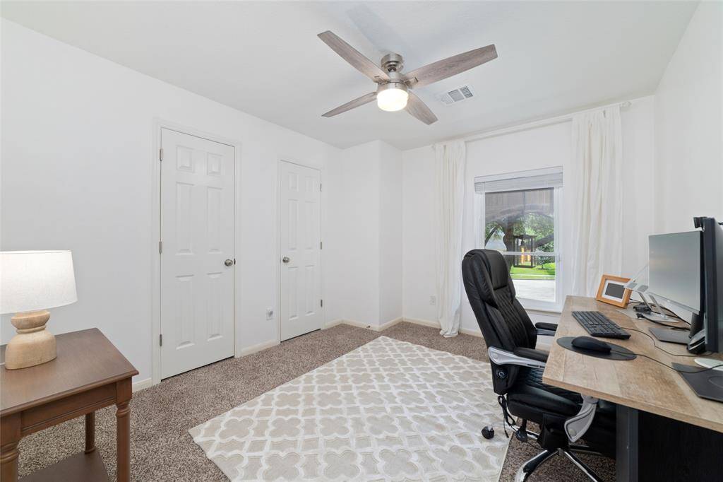 Large secondary bedroom currently used as an office.