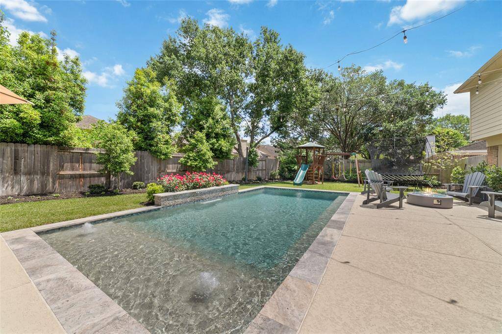 Amazing outdoor living space with sparkling pool and much more!