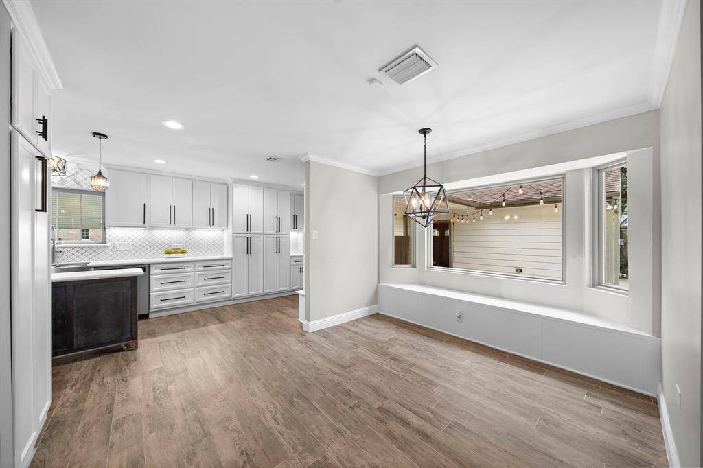 Bright dining area with pool views, seamlessly connected to the kitchen.