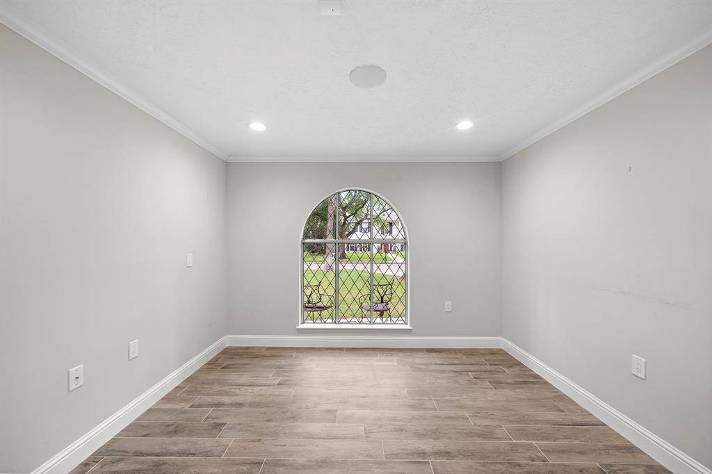 Cozy downstairs office with a privacy barn door and a charming window that steals the show!