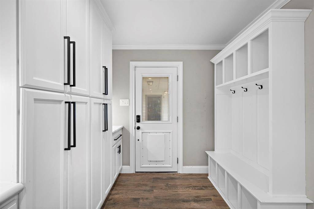 Convenient entry from the detached garage features a mudroom with a pet-friendly door.