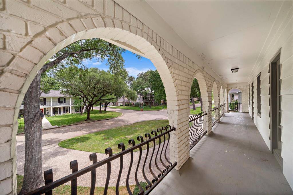An expansive covered balcony to enjoy views of your neighborhood.  Direct access from the primary and one of the secondary bedrooms.