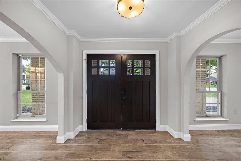Step through the inviting entrance from a spacious covered porch.