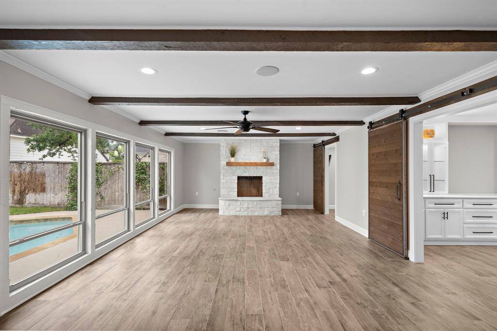 Experience the warmth and charm of this home with a stunning limestone fireplace as its centerpiece.