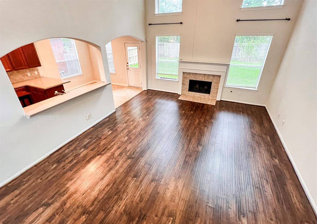 View of the downstairs family room looking from the 2nd floor.