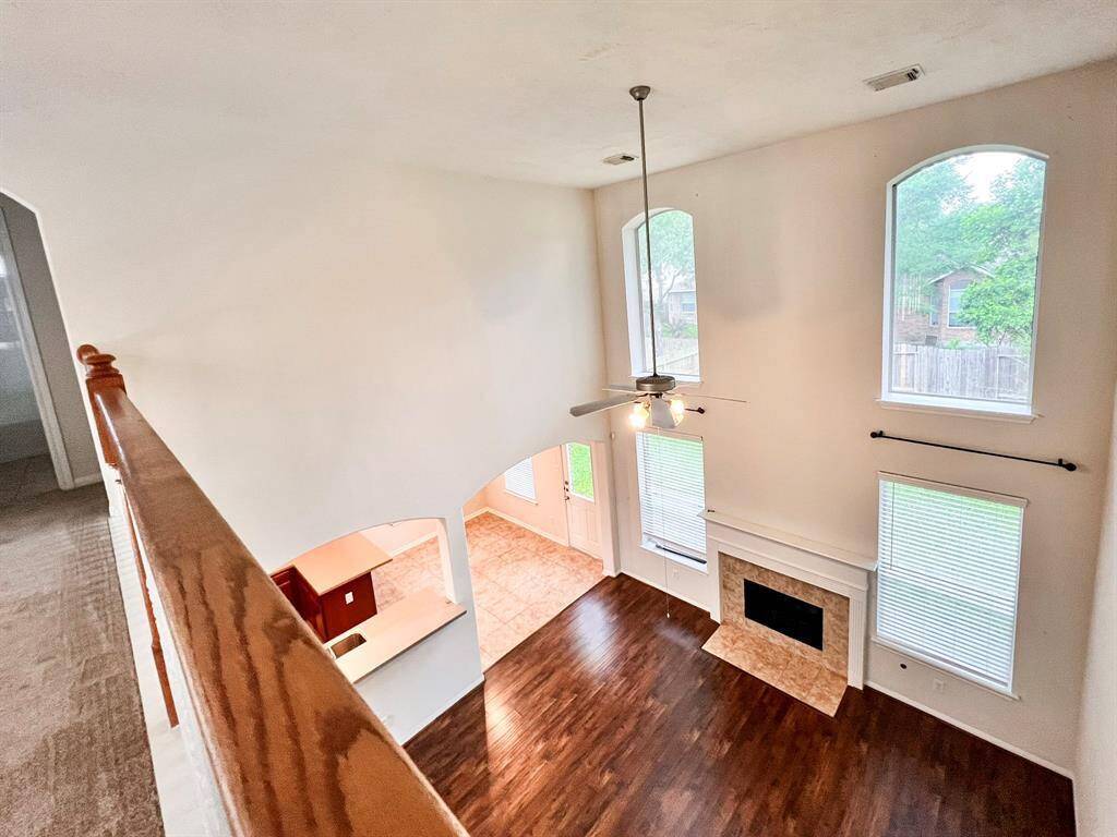 Another view of the downstairs family room from the upstairs catwalk.