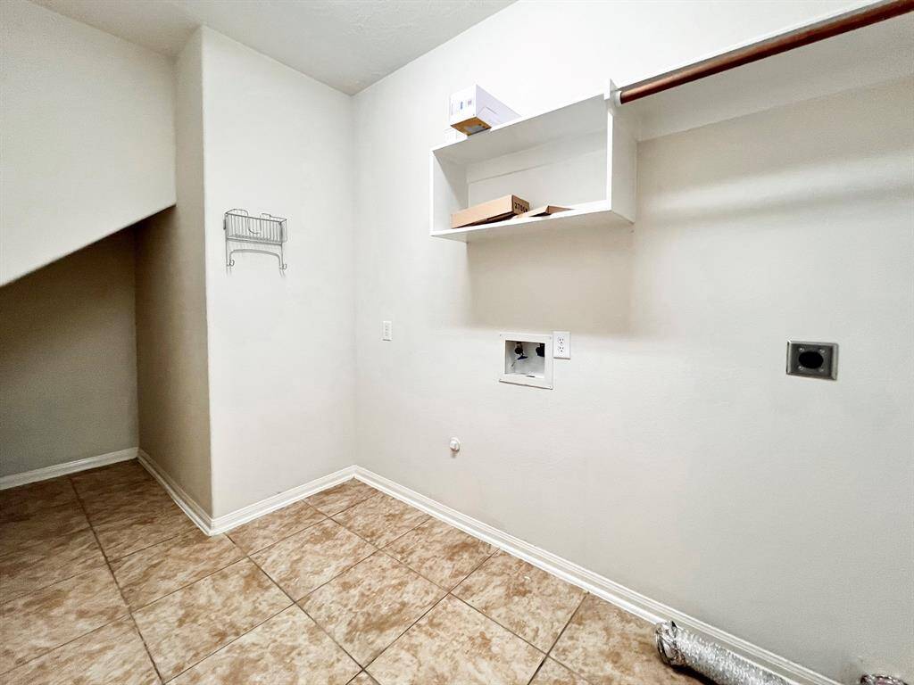 Utility room near the back garage entrance.
