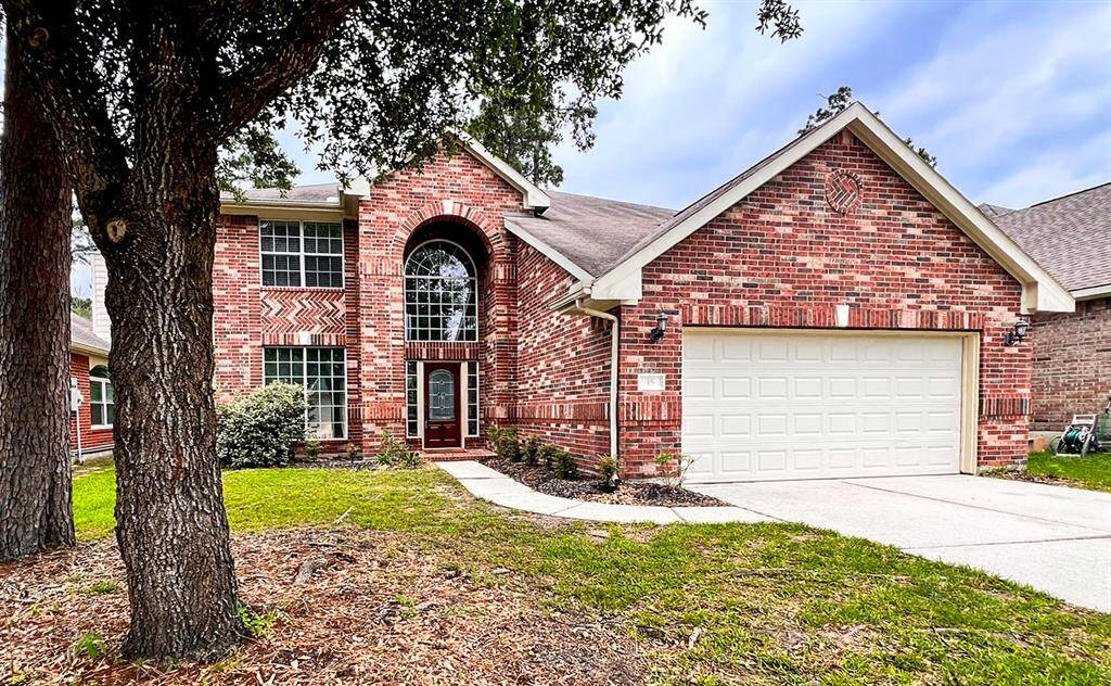 Two-story, 4 bedroom, 3 full bathrooms, 1 1/2 baths in The Woodlands with double-wide driveway.