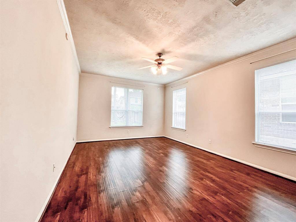 The primary bedroom suite is shown from the entry of the room.
