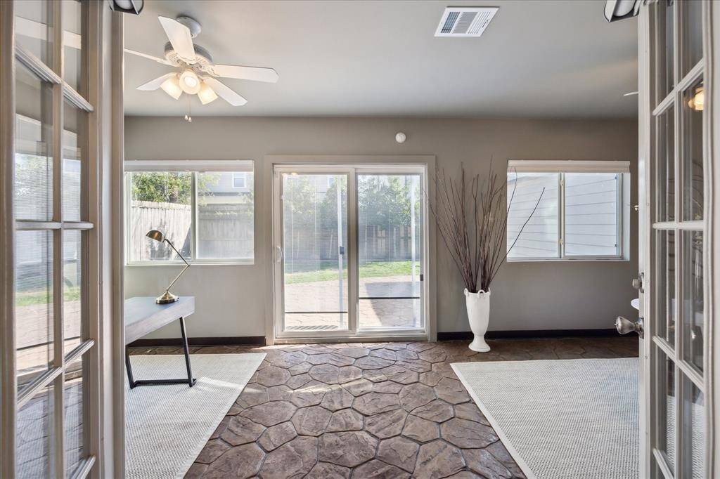 French doors leading to the flex space and home's backyard.