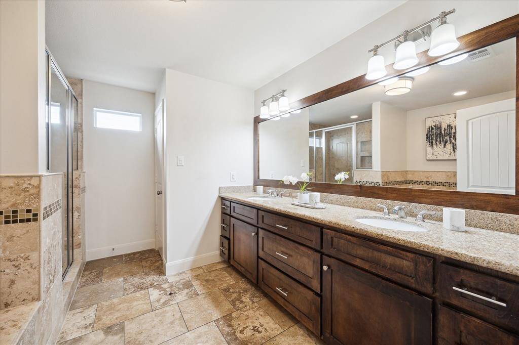 Primary bathroom with double sinks.
