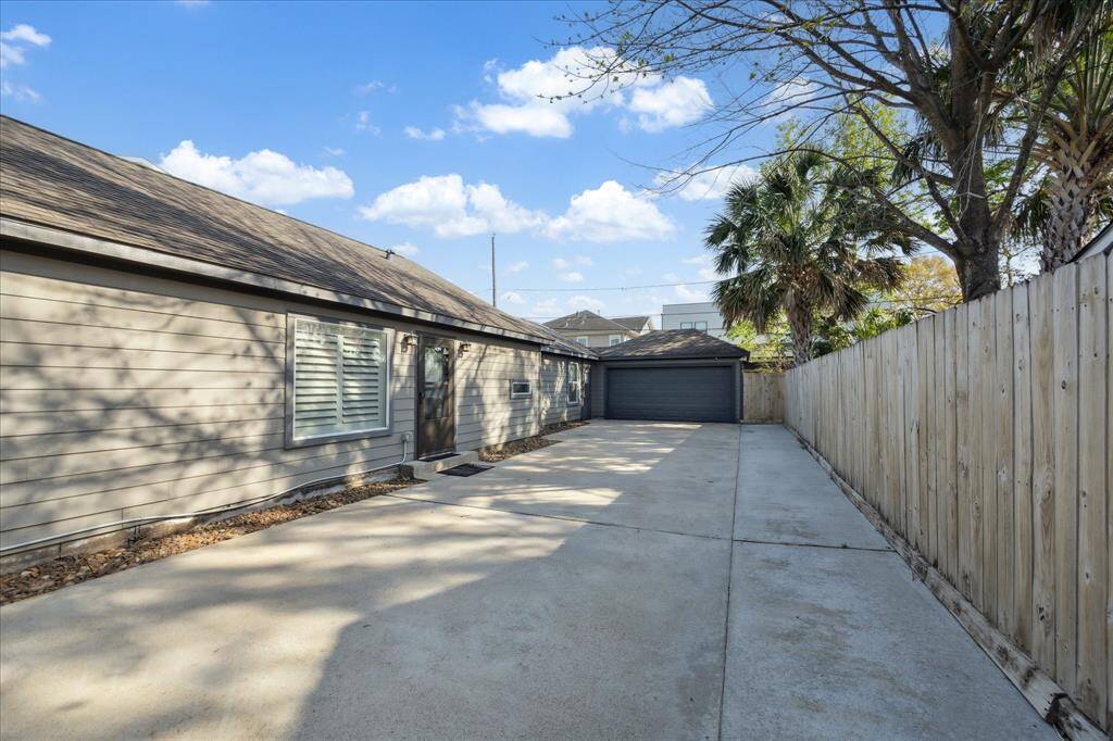 Gated, double-wide driveway.